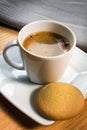 Cup of coffee and biscotti on white plate Royalty Free Stock Photo