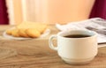 Cup of coffee , biscuits and the background newspaper. Royalty Free Stock Photo