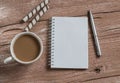 Cup of coffee, biscuits and a blank open notebook on a wooden table.Top view. Royalty Free Stock Photo