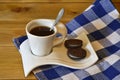 A cup of coffee and biscuits