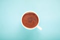 A cup of coffee on blue Royalty Free Stock Photo