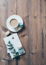 Cup of coffee and blue macaroons on wooden table background