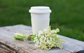 Cup of coffee and a bouquet of lilies of the valley