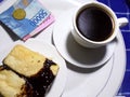 A cup of coffee and bread for breakfast at a cetral Java shop.