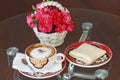 A cup of coffee and bread and flower Royalty Free Stock Photo