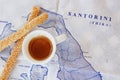 Cup of coffee and breadsticks on the map