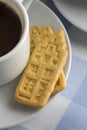 Cup of coffee with butter cookies in the shape of Dutch canal houses Royalty Free Stock Photo