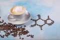 A cup of coffee with caffeine molecule created by coffee beans Royalty Free Stock Photo