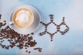 A cup of coffee with caffeine molecule created by coffee beans Royalty Free Stock Photo