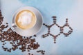 A cup of coffee with caffeine molecule created by coffee beans Royalty Free Stock Photo