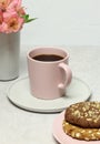 Cup of coffee, cakes, fresh flowers on grey stone table Royalty Free Stock Photo