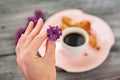 Cup of coffee, cakes and hand with a lilac branch Royalty Free Stock Photo