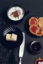 Cup of coffee, cappuccino with chocolate cookies and biscuits on black table background. Afternoon break time. Breakfast. Top view Royalty Free Stock Photo