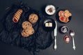 Cup of coffee, cappuccino with chocolate cookies and biscuits on black table background. Afternoon break time. Breakfast. Top view Royalty Free Stock Photo