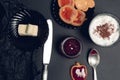 Cup of coffee, cappuccino with chocolate cookies and biscuits on black table background. Afternoon break time. Breakfast. Top view Royalty Free Stock Photo