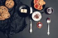 Cup of coffee, cappuccino with chocolate cookies and biscuits on black table background. Afternoon break time. Breakfast. Top view Royalty Free Stock Photo