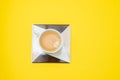 cup of coffee on ceraic on yellow paper Royalty Free Stock Photo