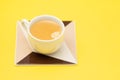 cup of coffee on ceraic on yellow paper Royalty Free Stock Photo