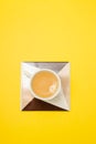 Cup of coffee on ceramic on yellow paper Royalty Free Stock Photo
