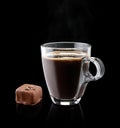 Cup of coffee with a chocolate bonbon Royalty Free Stock Photo