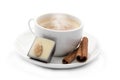 Cup of coffee with chocolate candy and cinnamons