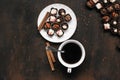 Cup of coffee and chocolate candy on wooden table. Morning breakfast. Work, relax concept Royalty Free Stock Photo