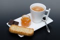 A cup of coffee with chocolate, jam and a rusk Royalty Free Stock Photo
