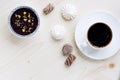 Cup of coffee, chocolates, meringue, a cottage cheese dessert of handwork on a wooden background Royalty Free Stock Photo