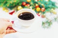 Cup of coffee on a christmas background. Christmas morning. Selective focus. Royalty Free Stock Photo