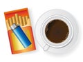 Cup of coffee and cigarette in box