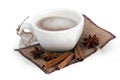 Cup of coffee with cinnamon sticks and star anise on a sackcloth Royalty Free Stock Photo