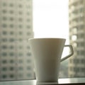 Cup of coffee with city scape background