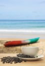 Cup of coffee with coffee bean on the beach background Royalty Free Stock Photo