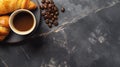 Cup of coffee with coffee bean, pastry, croissant on rustic black table counter background, text copy space, top view Royalty Free Stock Photo