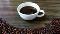 Cup of coffee on wooden background