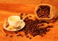 Cup of coffee with coffee beans, burlap sack, bag Royalty Free Stock Photo