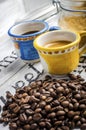 Cup of coffee and coffee beans and cane sugar Royalty Free Stock Photo