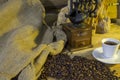 Cup of coffee, coffee-beans, coffee grinder, coffee sack Royalty Free Stock Photo