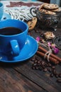 The cup of coffee, coffee beans and cookies-hearts related together on wooden table. Royalty Free Stock Photo