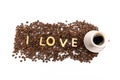 Cup of coffee and coffee beans with cookies in shape of Love word Royalty Free Stock Photo