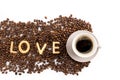 Cup of coffee and coffee beans with cookies in shape of Love word Royalty Free Stock Photo