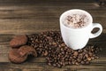 Cup of coffee with coffee beans and cookies Royalty Free Stock Photo