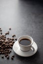 Cup of coffee with coffee beans with interesting light