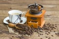 Cup of coffee, coffee beans and old coffee grinder Royalty Free Stock Photo
