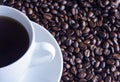 Cup of coffee and coffee beans Royalty Free Stock Photo