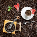 Cup of coffee and coffee grinder Royalty Free Stock Photo