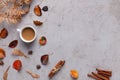 Cup of Coffee with colored fallen leaves on gray background Royalty Free Stock Photo