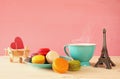 Cup of coffee and colorful macaron