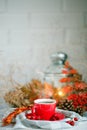 Cup of coffee, cones and autumn leaves on a wooden table. Autumn background. Royalty Free Stock Photo