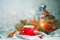 Cup of coffee, cones and autumn leaves on a wooden table. Autumn background.